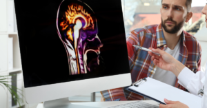 clinic system where doc is showing screen with brain scan to patient
