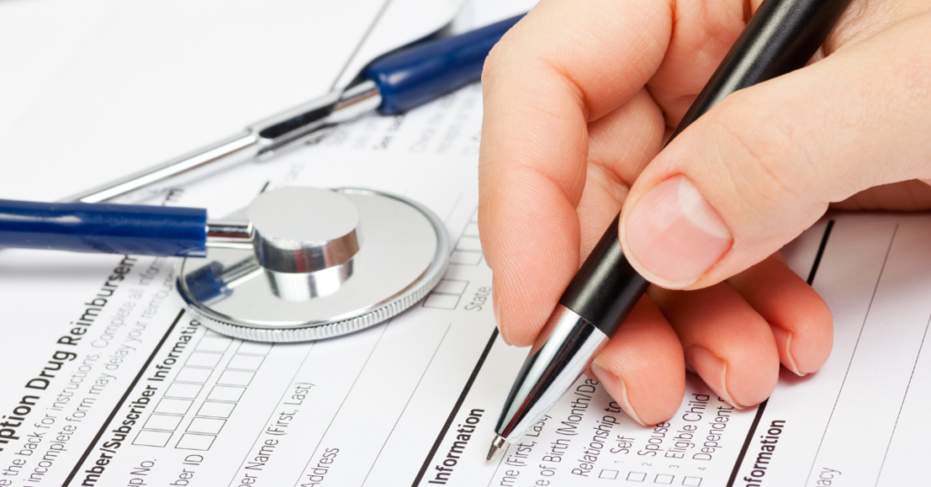 patient data sheet being written on by a hand